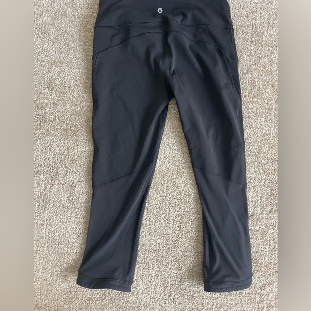 Lululemon size 8 leggings with mesh panel on back of the legs.